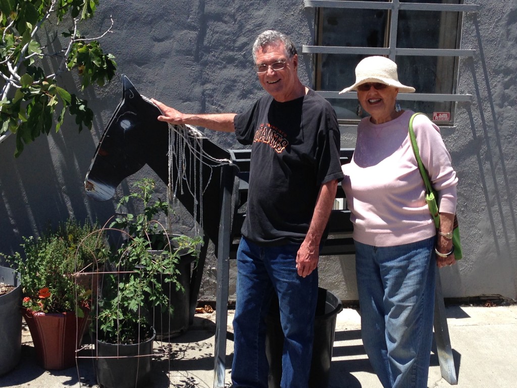 David Vallerga and Joanne McMahon check out a storefront at the July 2014 street retreat.