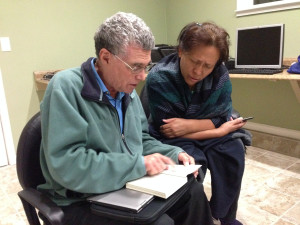 Silvia Ramirez (right) helps David Vallerga (left) with his Spanish at our monthly book group.